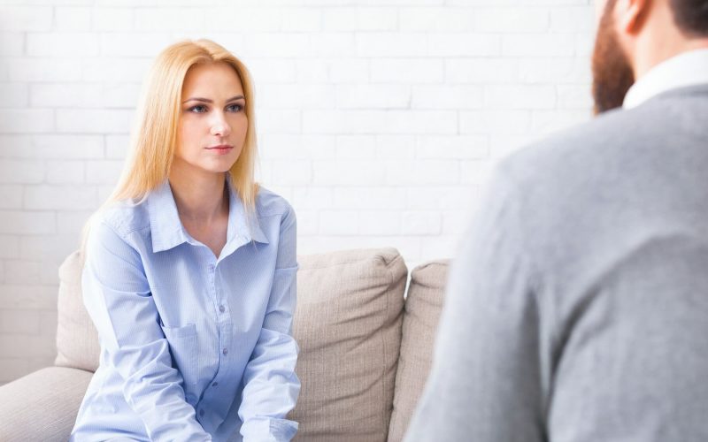 millennial-woman-carefully-listening-to-professional-life-coach.jpg